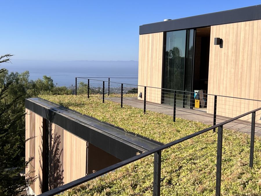 Steel cable railing on a green roof overlooking the Pacific