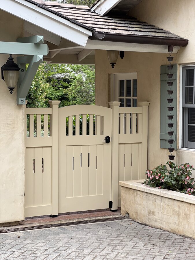 Cream craftsman-style vertical gate with lattice top in Montecito