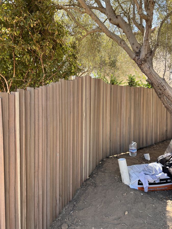 Custom vertical pole fence on a Santa Barbara hillside