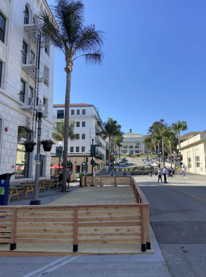 Horizontal cedar parklet fencing on a downtown street corner