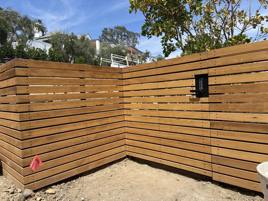 Keypad-entry gate in a horizontal slat fence