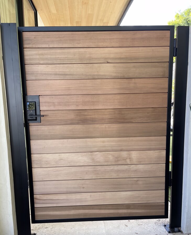 Horizontal wood slat gate with keypad entry in Santa Barbara