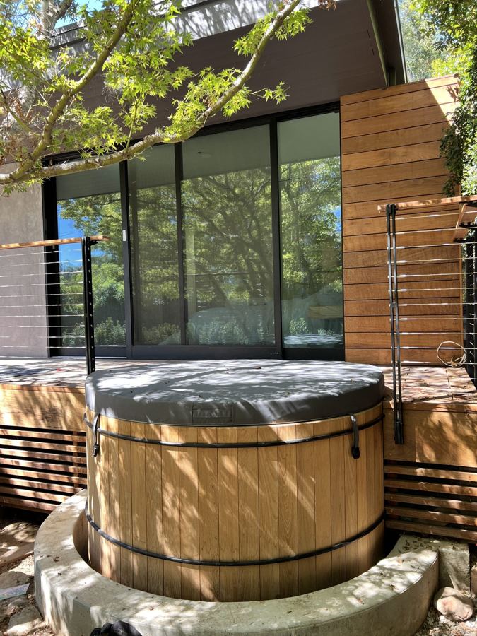 Cedar hot tub with custom privacy screen and cable railing