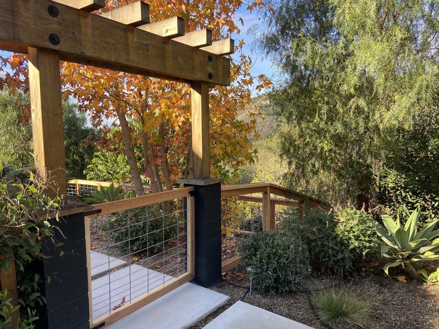 Pergola entry with hog wire gate