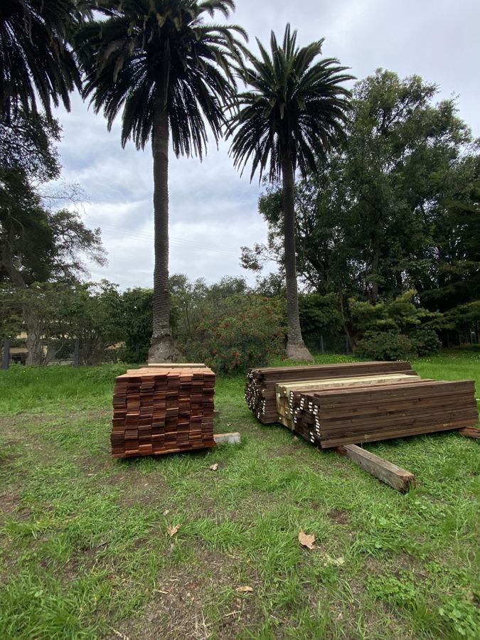 Redwood fence lumber staged for a ranch project