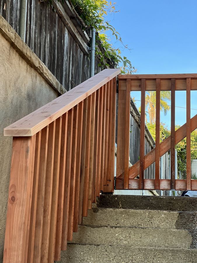 Redwood stair railing on exterior steps