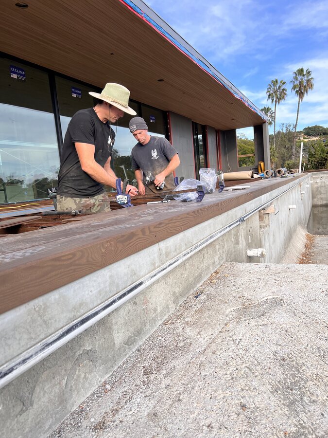 Lighthouse Fence crew installing a rooftop deck with ocean views in Montecito