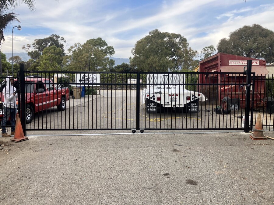 Steel rolling gate securing a commercial vehicle yard in Santa Barbara