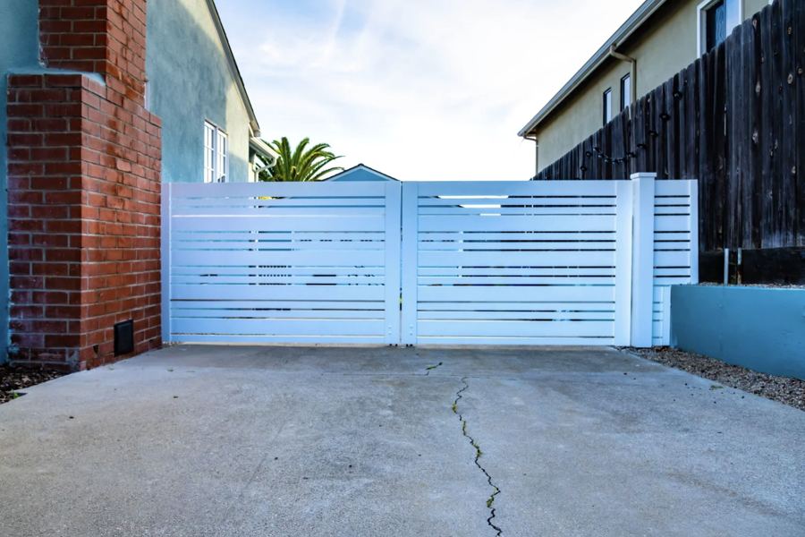 White horizontal slat double driveway gate