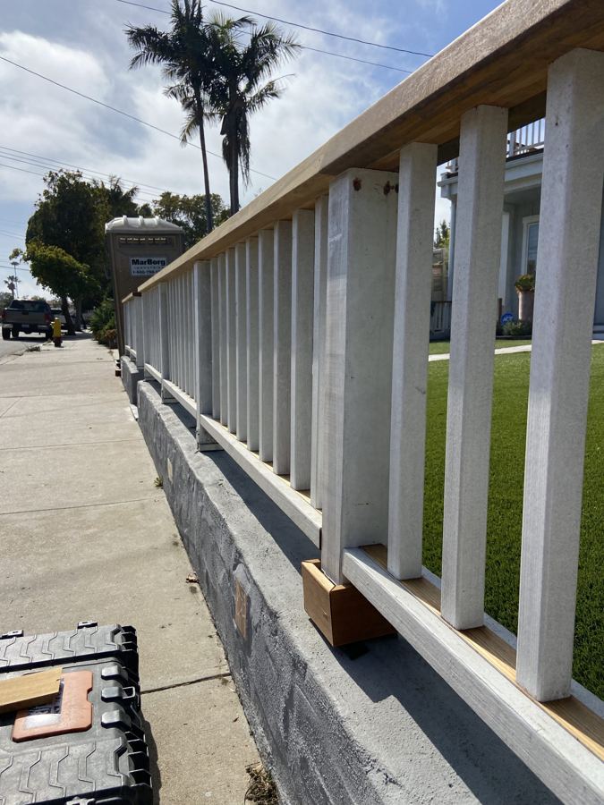 White railing with warm wood top rail